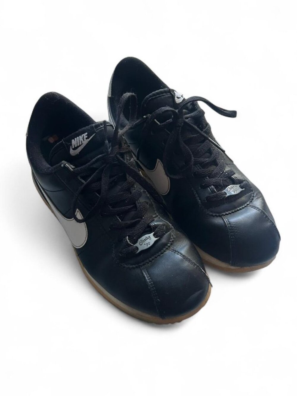 black and white Nike Cortez sneakers feature signature "Cortez '72" size 8.5